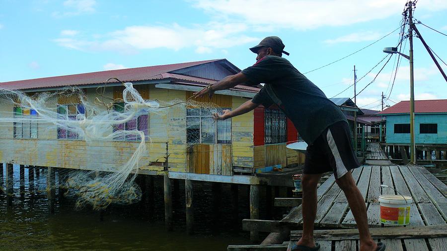 Fishing in Kampung Ayer Photograph by Robert Bociaga