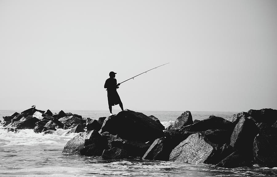 Fishing Silhouette on Rocks, Venice Beach, Los Angeles, California Photograph by Jay De Winne