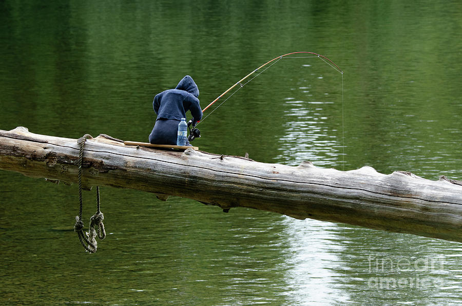 Fishing Twenty-Four Seven Photograph by Bob Christopher