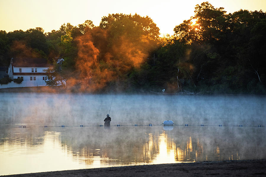 Fishing under fiery mist Silver Lake Wilmington Massachusetts Photograph by Toby McGuire