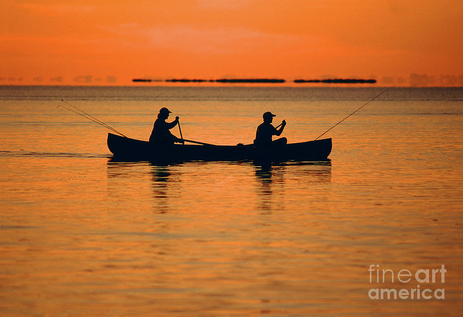 Fishermen Paddeling a Canoe at Florida Bay, Everglades National Park Photograph by Wernher Krutein
