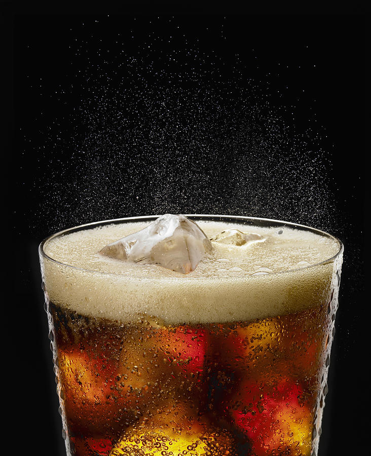 Fizzy glass of cola Photograph by Jack Andersen