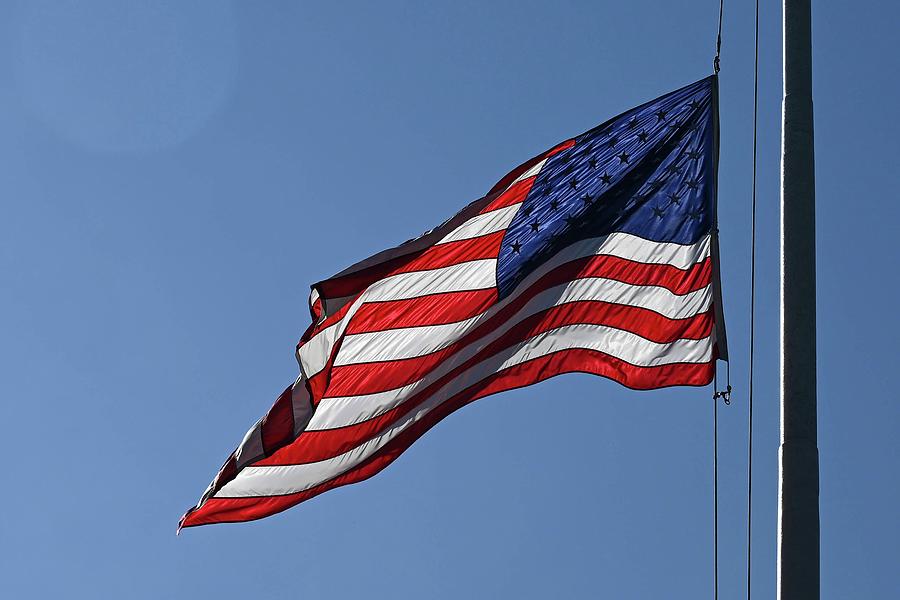 Flag Lowering Photograph by DeepEarth Images - Fine Art America