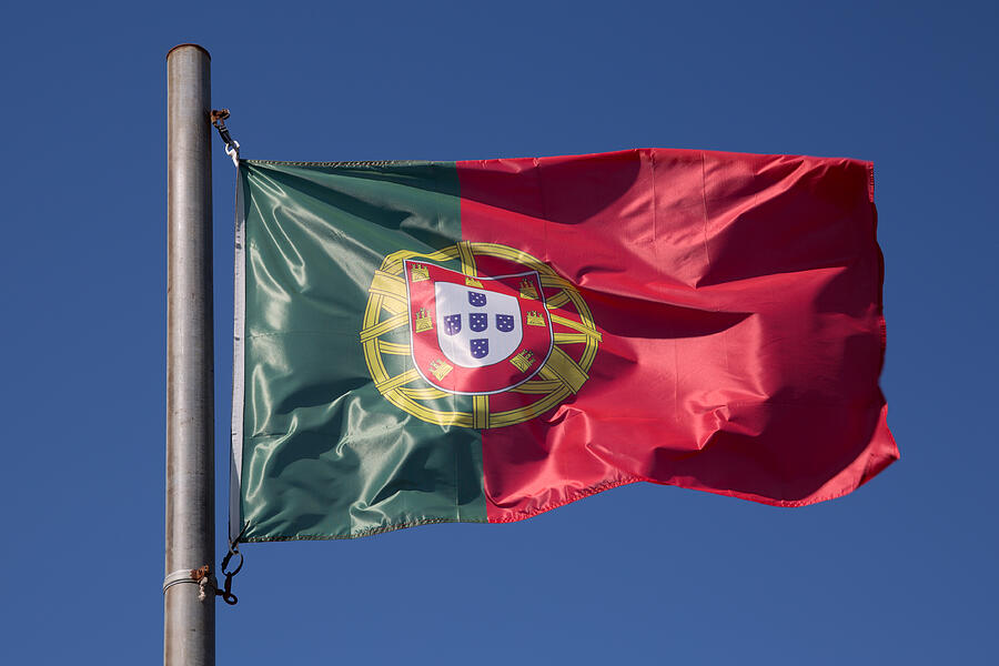 Flag of Portugal in the wind, Portugal Photograph by OceanProd