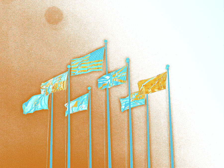 Flags Against An Orange And White Sky Digital Art by David Desautel
