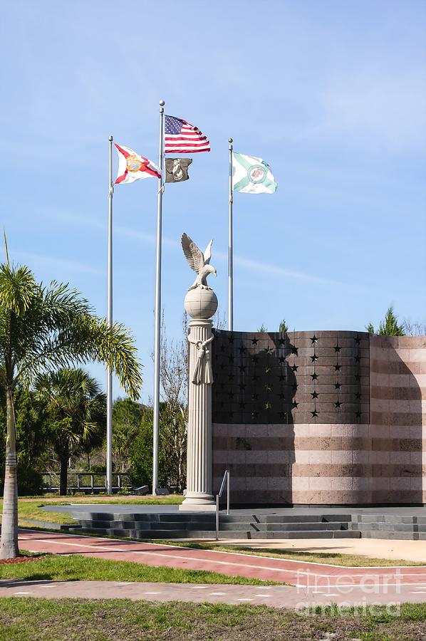 Flags fly at the Collier County Freedom Memorial at Freedom Park in Naples, Florida Photograph by William Kuta