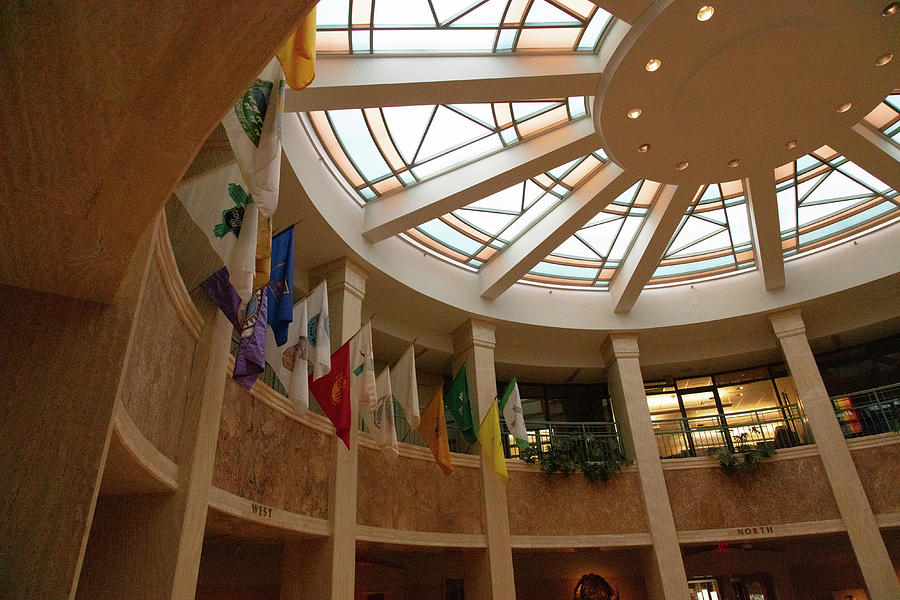 Flags hanging inside New Mexico state capitol building Photograph by Eldon McGraw