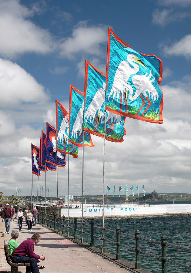 Flags on Penzance Promenade Photograph by Tony Mills