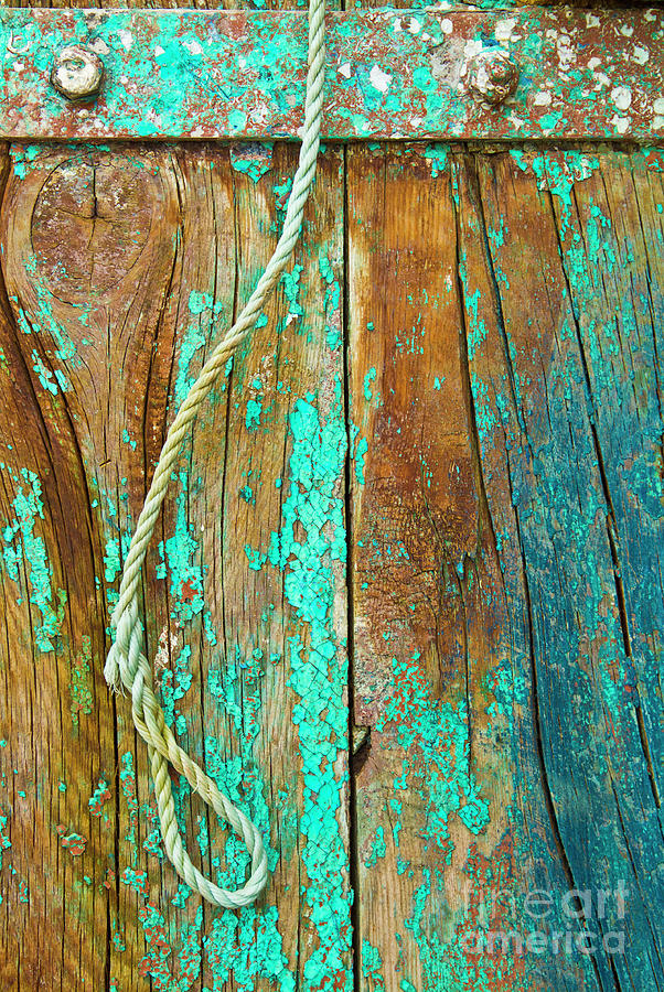 Flaking paint and rope loop on wooden beams Photograph by Neale And Judith Clark
