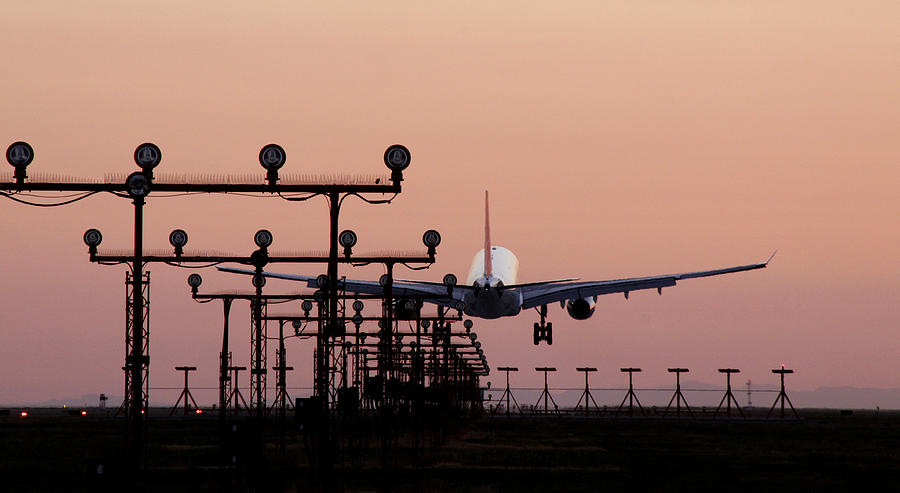 Flight landing at airport Photograph by Viviana Singh