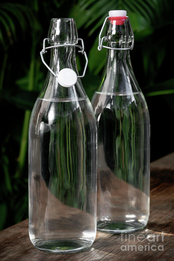 Flip Top Clear Water Bottle Outdoors On Garden Table Photograph