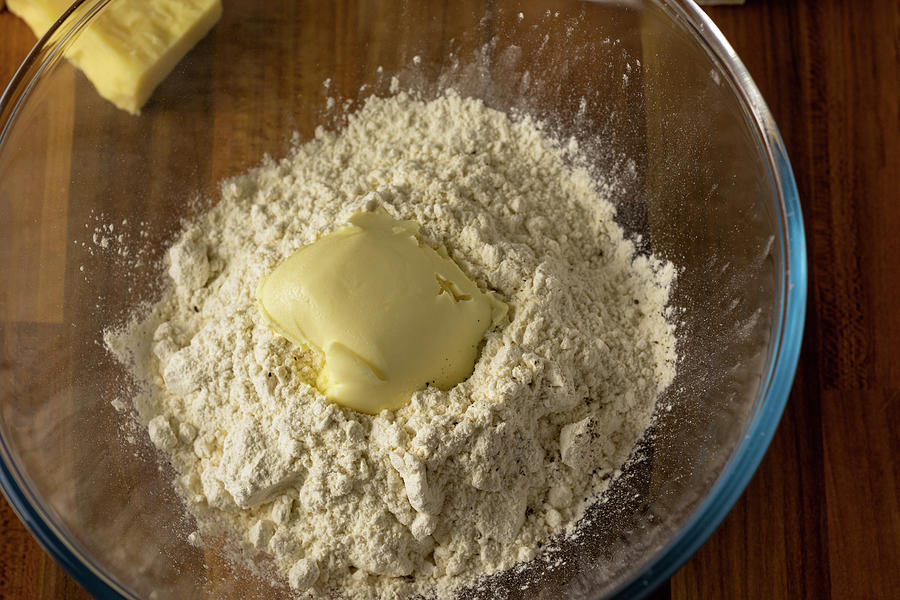 Flour, butter and pepper in a clear glass bowl Photograph by Scott Lyons