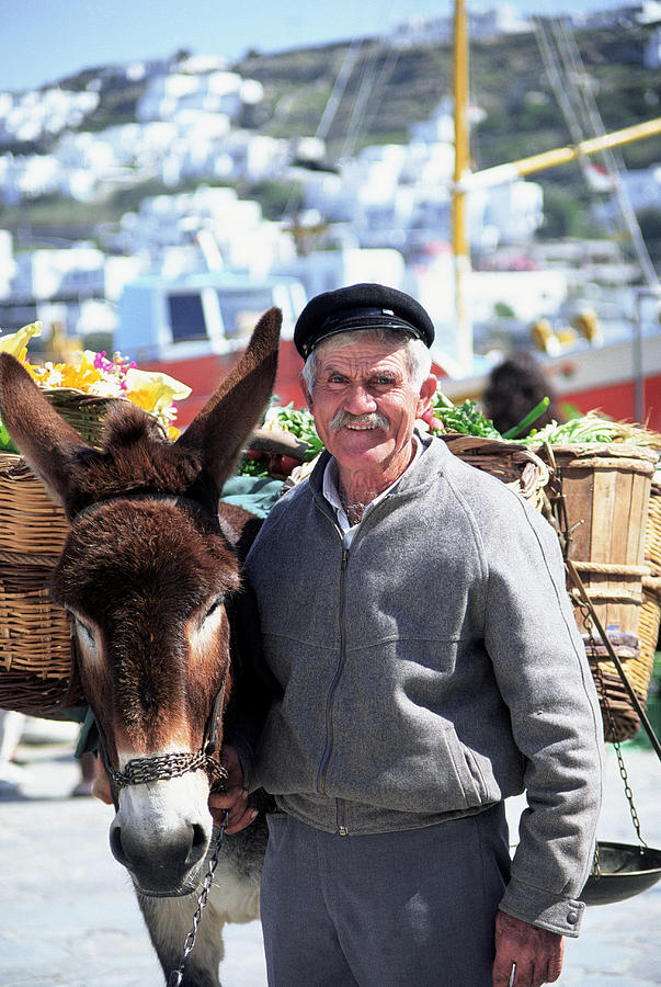 Flower seller, Mykonos, Greece Photograph by Peter Adams