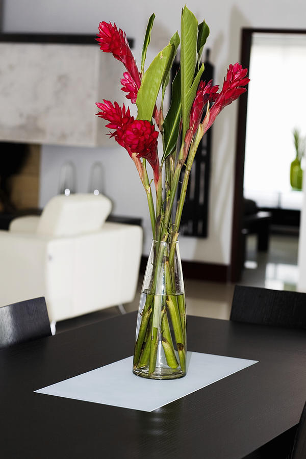 Flower vase on a table Photograph by Glowimages