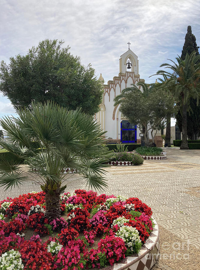 Flowers and church at Huelva Cemetery Photograph by Phil Banks