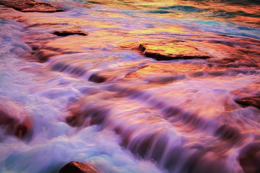 Flowing tide Photograph by Giovanni Allievi