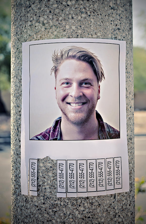Flyer with phone numbers & mans picture on a post Photograph by Caroline Purser
