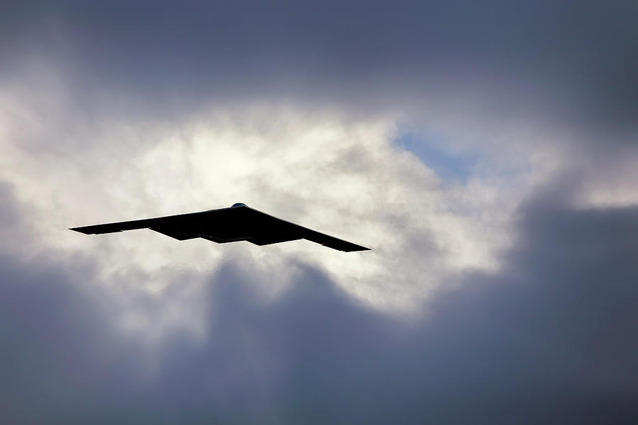 Flying out of the Clouds - B-2 Stealth Bomber - Air Force Pilot Photograph by Jason Politte