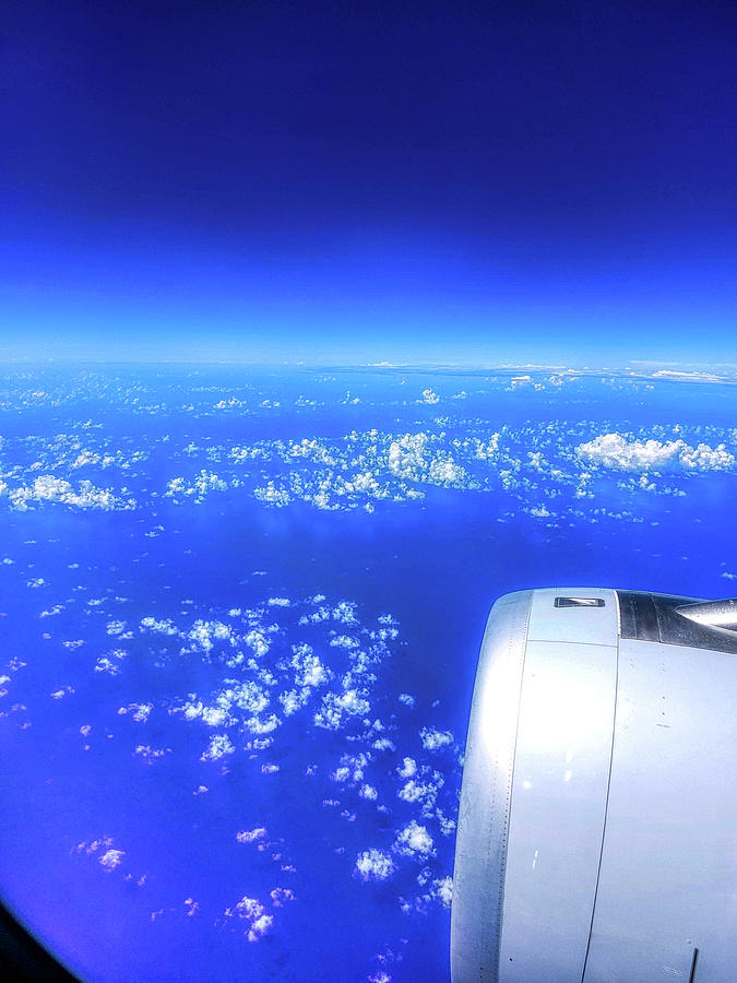Flying over the Pacific Ocean Photograph by Chance Kafka
