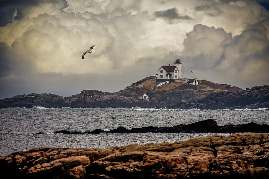 Flying Solo at Nubble Lighthouse Photograph by Jeff Folger