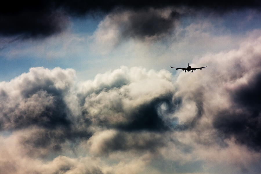 Flying through clouds Photograph by Greg Bajor