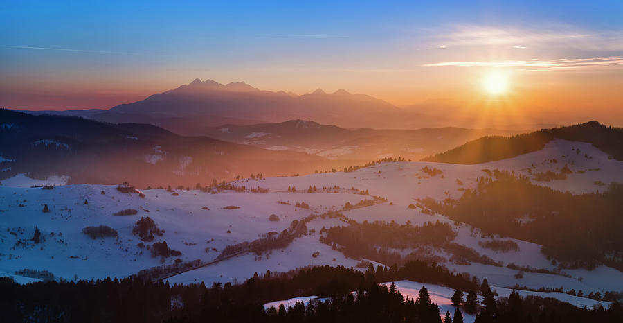 Fog in Pieniny Mountains in winter at sunrise and Tatra Mountains in background, Lesser Poland Photograph by Panoramic Images