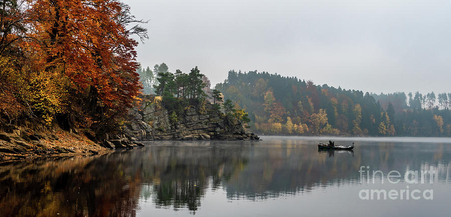 Foggy Landscape With Fishermans Boat On Calm Lake And Autumnal Forest At Lake Ottenstein In Austria Photograph by Andreas Berthold