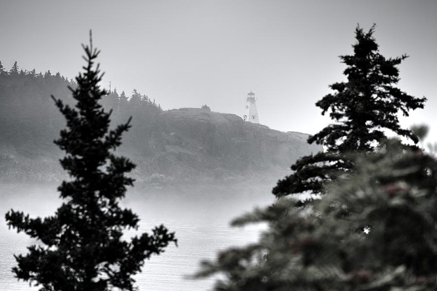 Foggy Lighthouse  Photograph by David Matthews