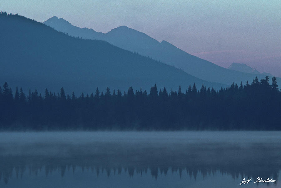 Foggy Mountains and Reflections in a Lake Photograph by Jeff Goulden