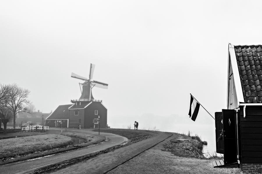 Foggy windmill in Zaanse Schans Photograph by Pedro Cardona Llambias