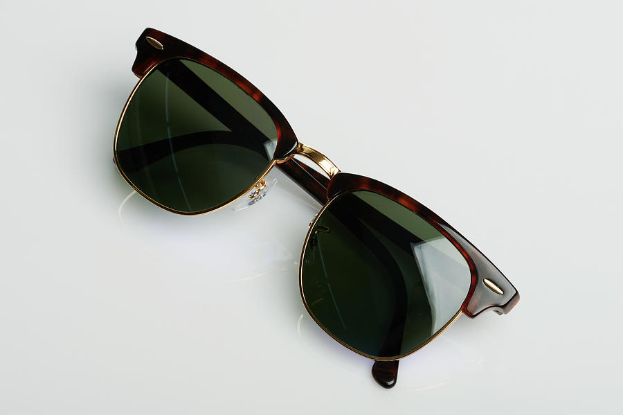 Folded sunglasses with dark lens Photograph by Dimarik