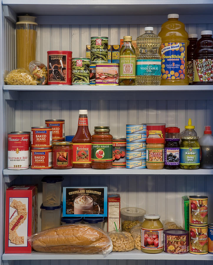 Food items on pantry shelves Photograph by Don Farrall