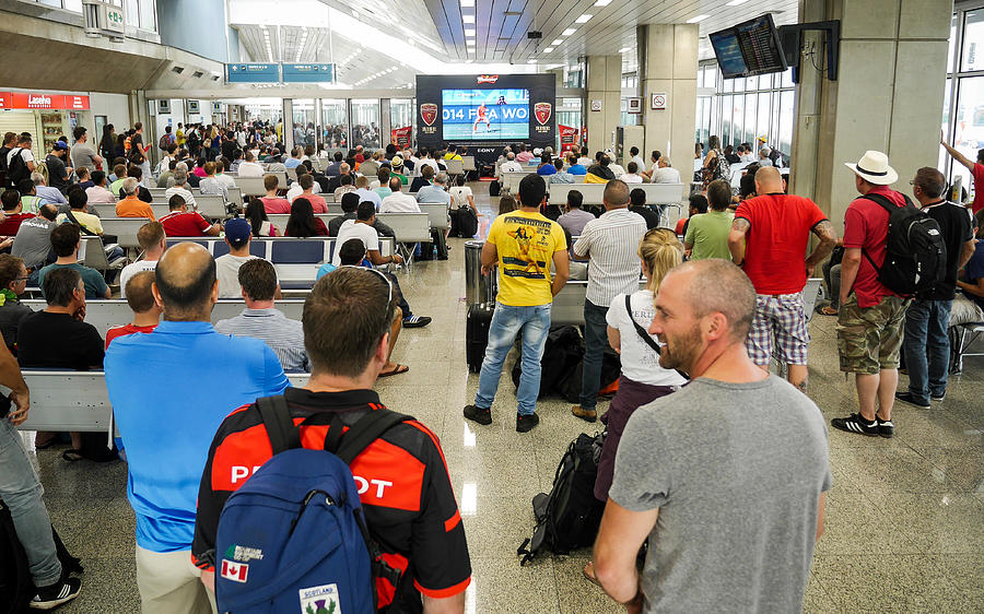 Football fans at Brasilia airport, Brazil Photograph by Track5
