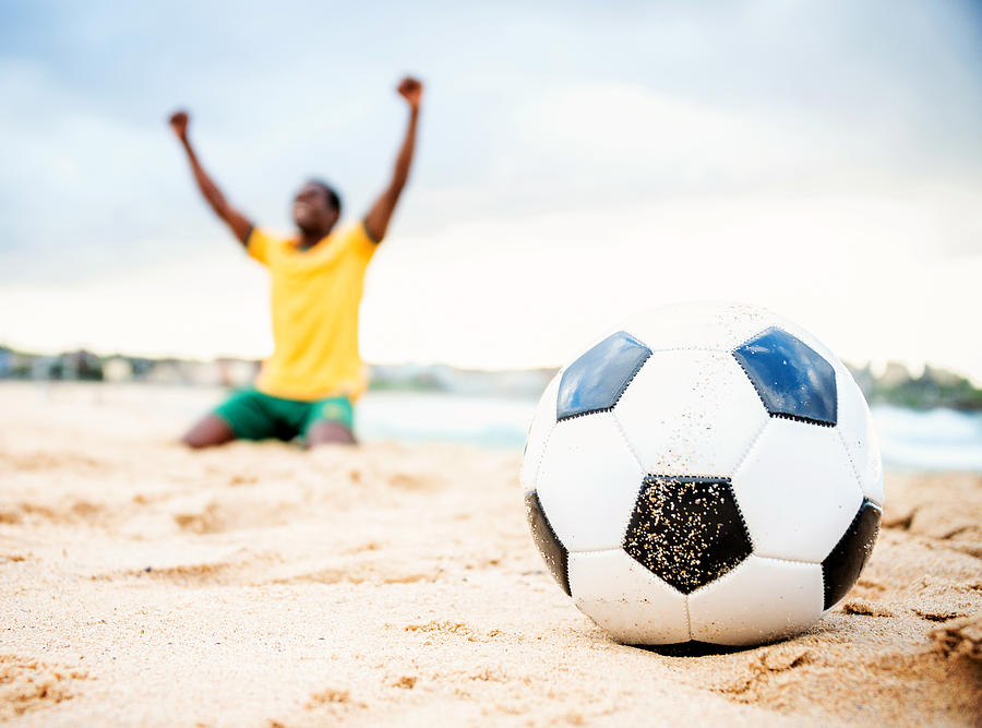 Football player at the beach in Brazil Photograph by Andresr