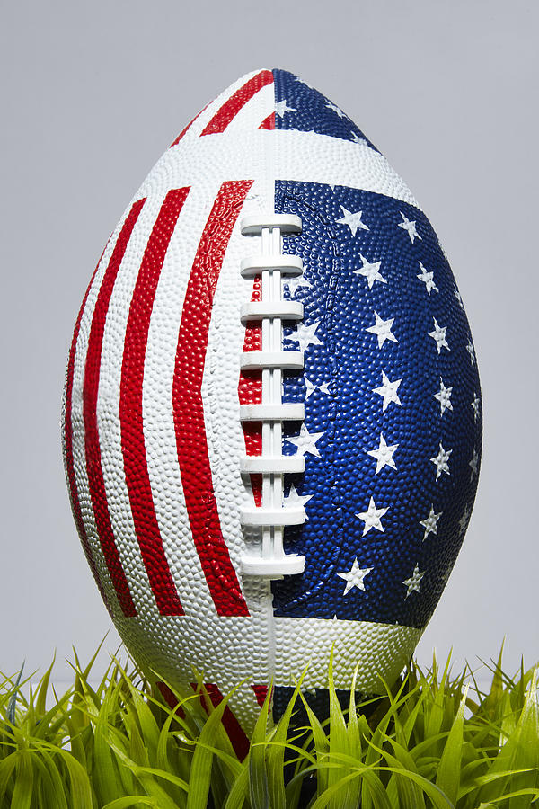 Football with American Stars and Stripes in Grass Photograph by Shana Novak