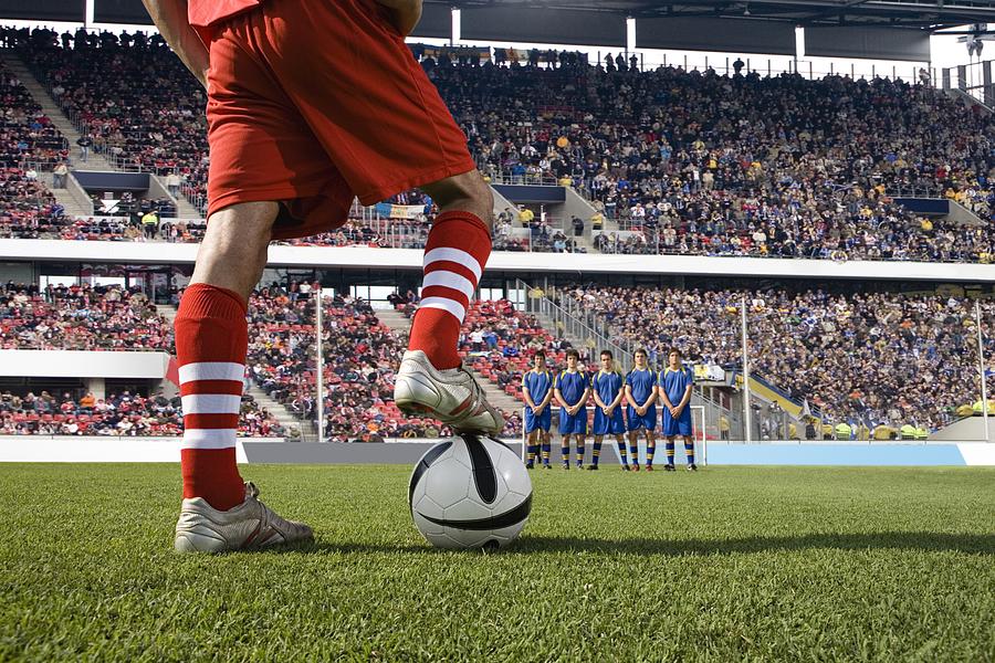 Footballer about to take a free kick Photograph by Image Source