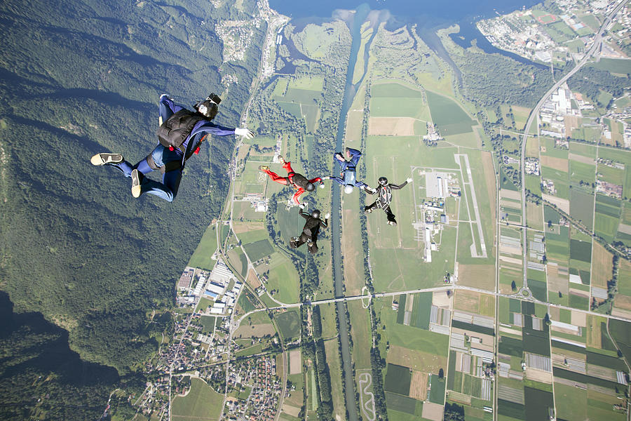 Formation skydiving team is getting filmed Photograph by Oliver Furrer