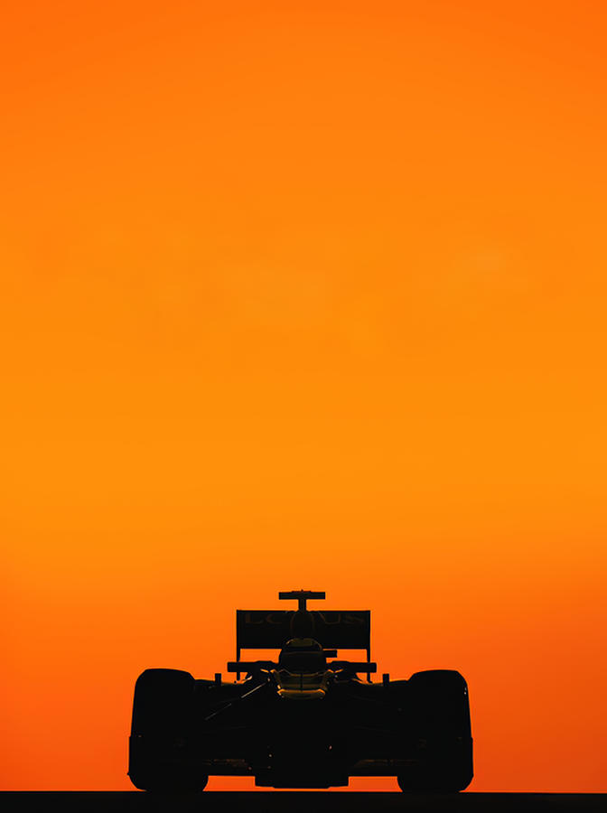 Formula 1 race car set in orange background Photograph by Retrographs