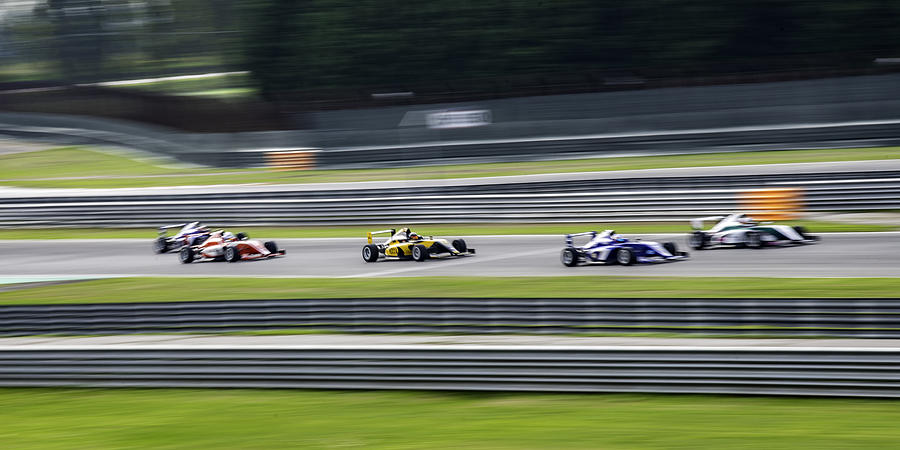 Formula race cars driving fast Photograph by Vm