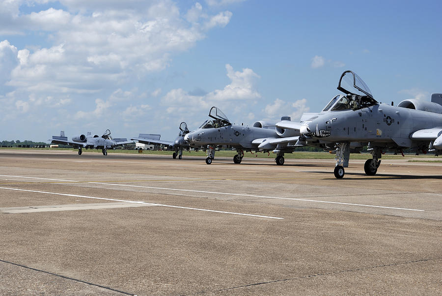 Four A-10 Thunderbolt IIs return from flying a sortie. Photograph by Stocktrek Images Four A-10 Thunderbolt IIs return from flying a sortie. Photograph by Stocktrek Images