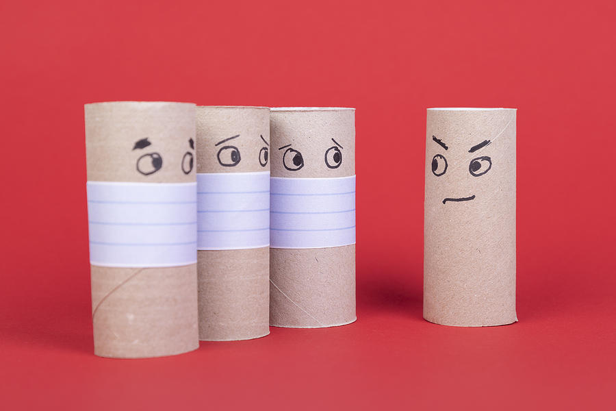 Four Empty Toilet Paper Rolls, Three With Face Mask Looking To One Without Mouth Protection Photograph by Thomas Stockhausen