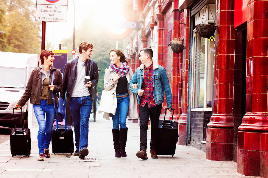 Four friends arriving in London Photograph by NicolasMcComber