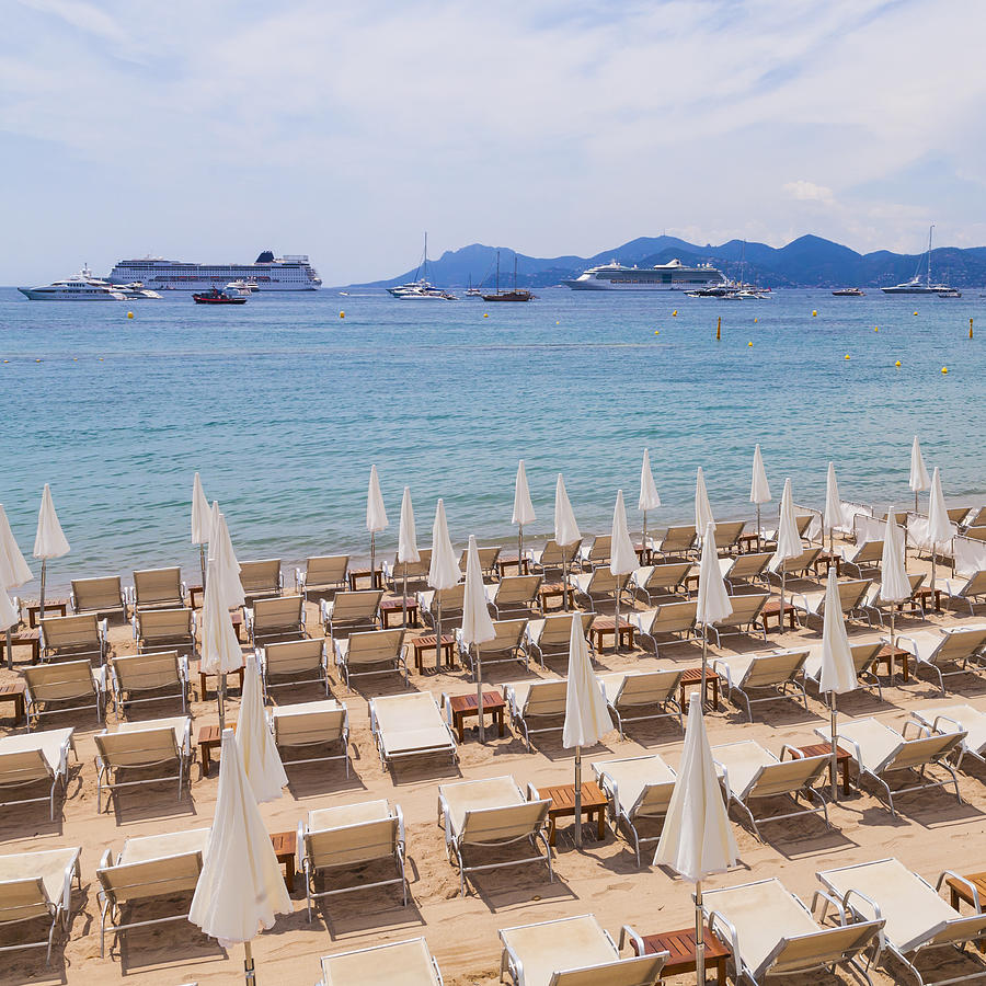 France, Cote dAzur, Cannes, sun loungers and beach umbrellas on beach Photograph by Westend61