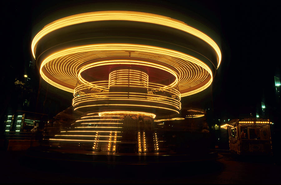 France, Marseille, spinning old fashioned carousel at night Photograph by Sami Sarkis