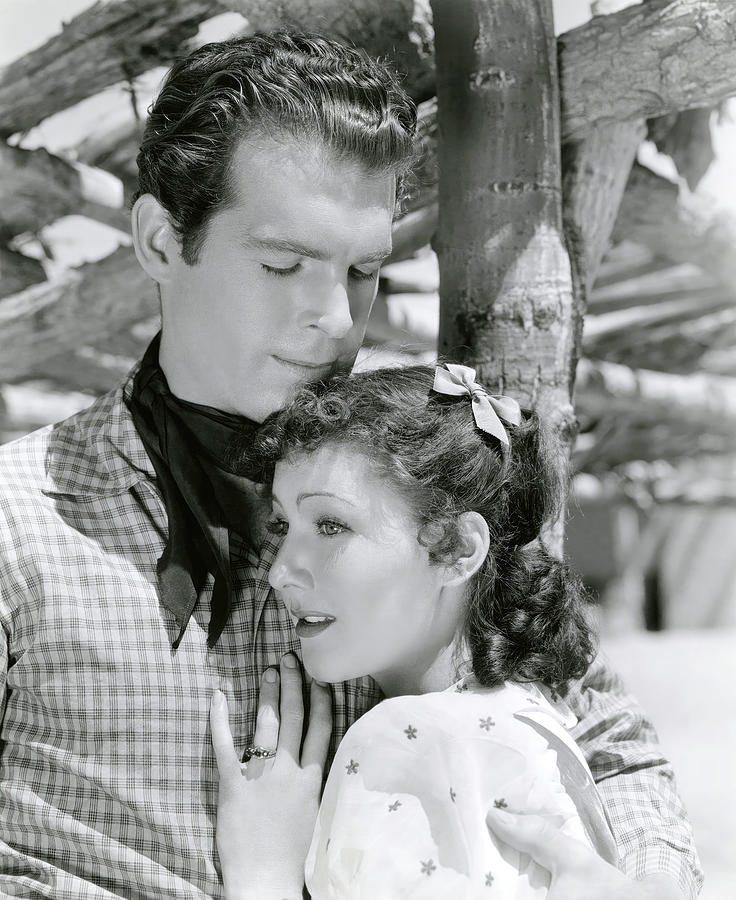 FRED MACMURRAY and JEAN PARKER in THE TEXAS RANGERS -1936-, directed by KING VIDOR. Photograph by Album