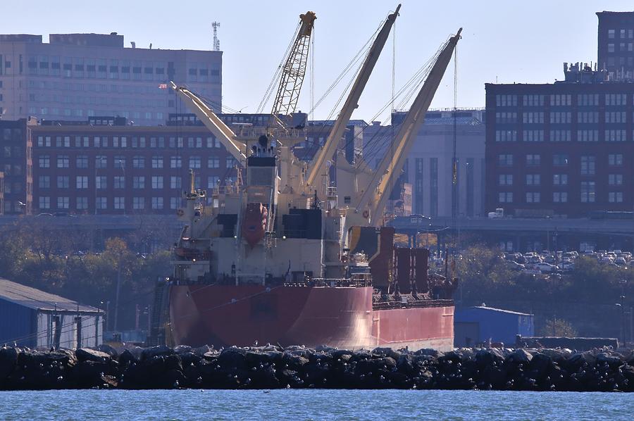 Freight ship uses its on board cranes to load cargo, Cleveland, Ohio, USA Photograph by Douglas Sacha