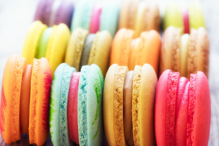French colorful macarons background, close up Photograph by Busakorn Pongparnit