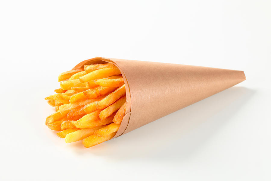 French fries in a paper cone Photograph by Milanfoto