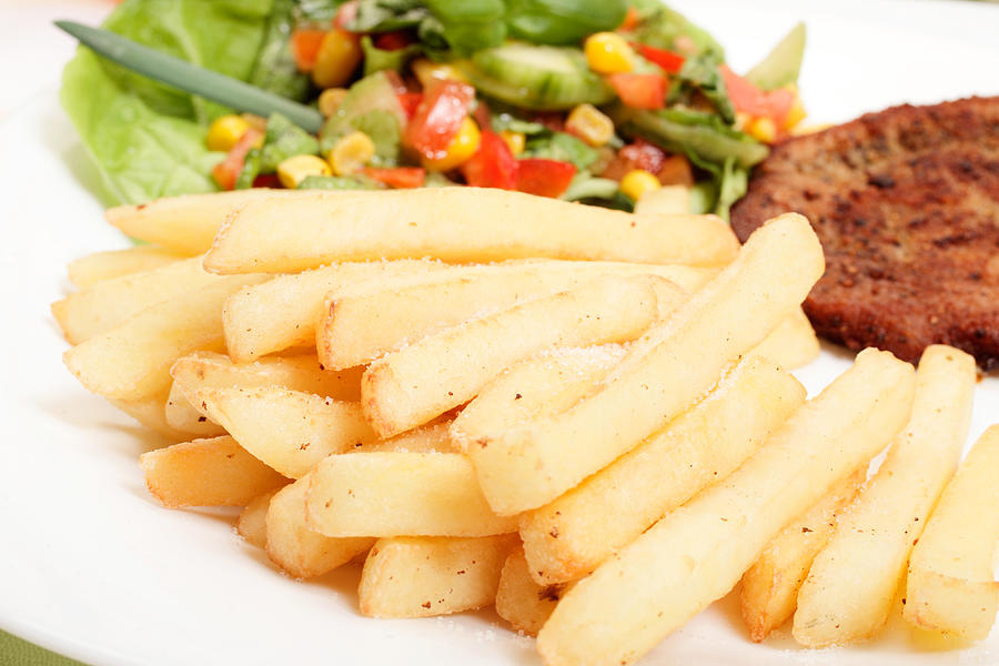 French fries, salad and chop Photograph by Fotek