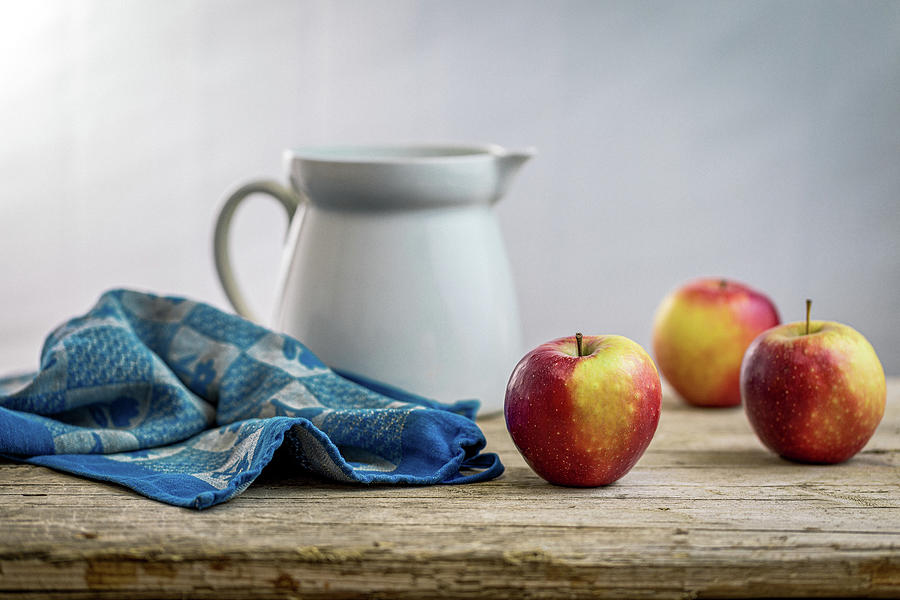 Fresh apples on a rustic wooden table Photograph by Benoit Bruchez
